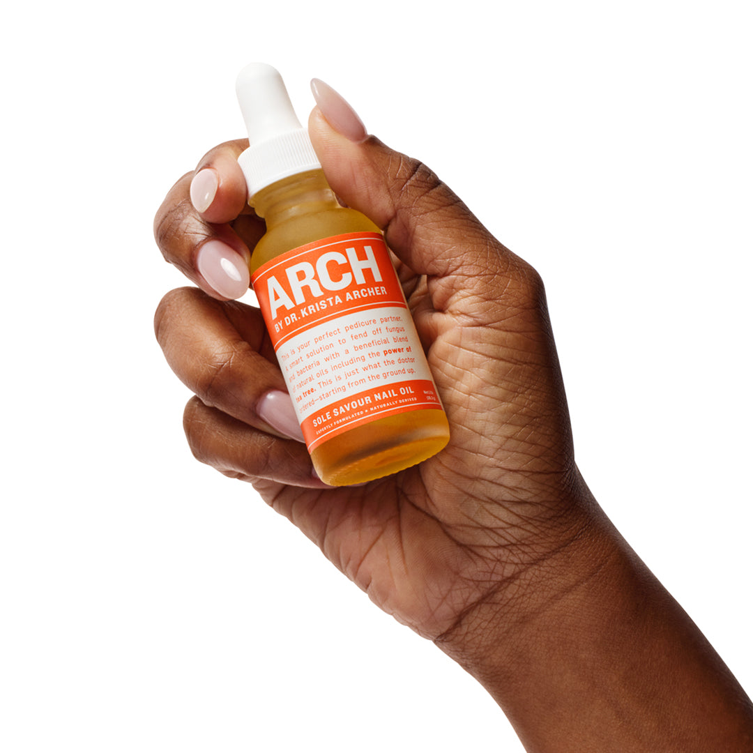 HAND HOLDING SOLE SAVOUR NAIL OIL