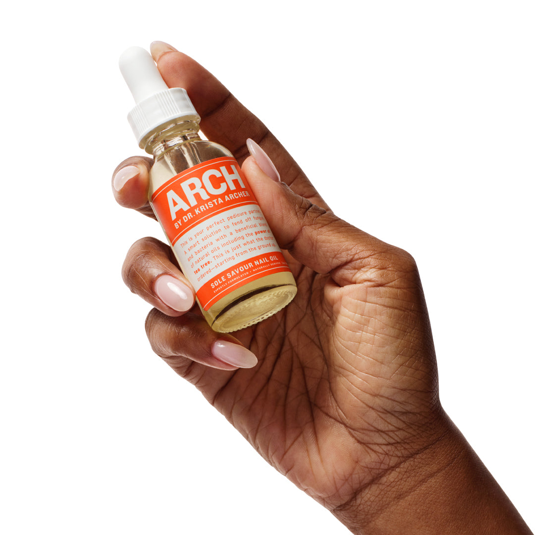 HAND HOLDING SOLE SAVOUR NAIL OIL WITH EMU OIL