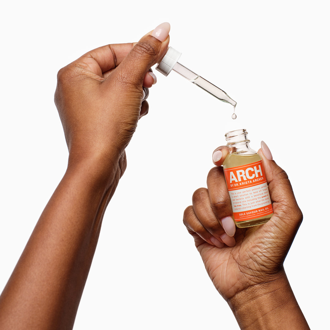 HANDS APPLYING SOLE SAVOUR NAIL OIL WITH EMU OIL