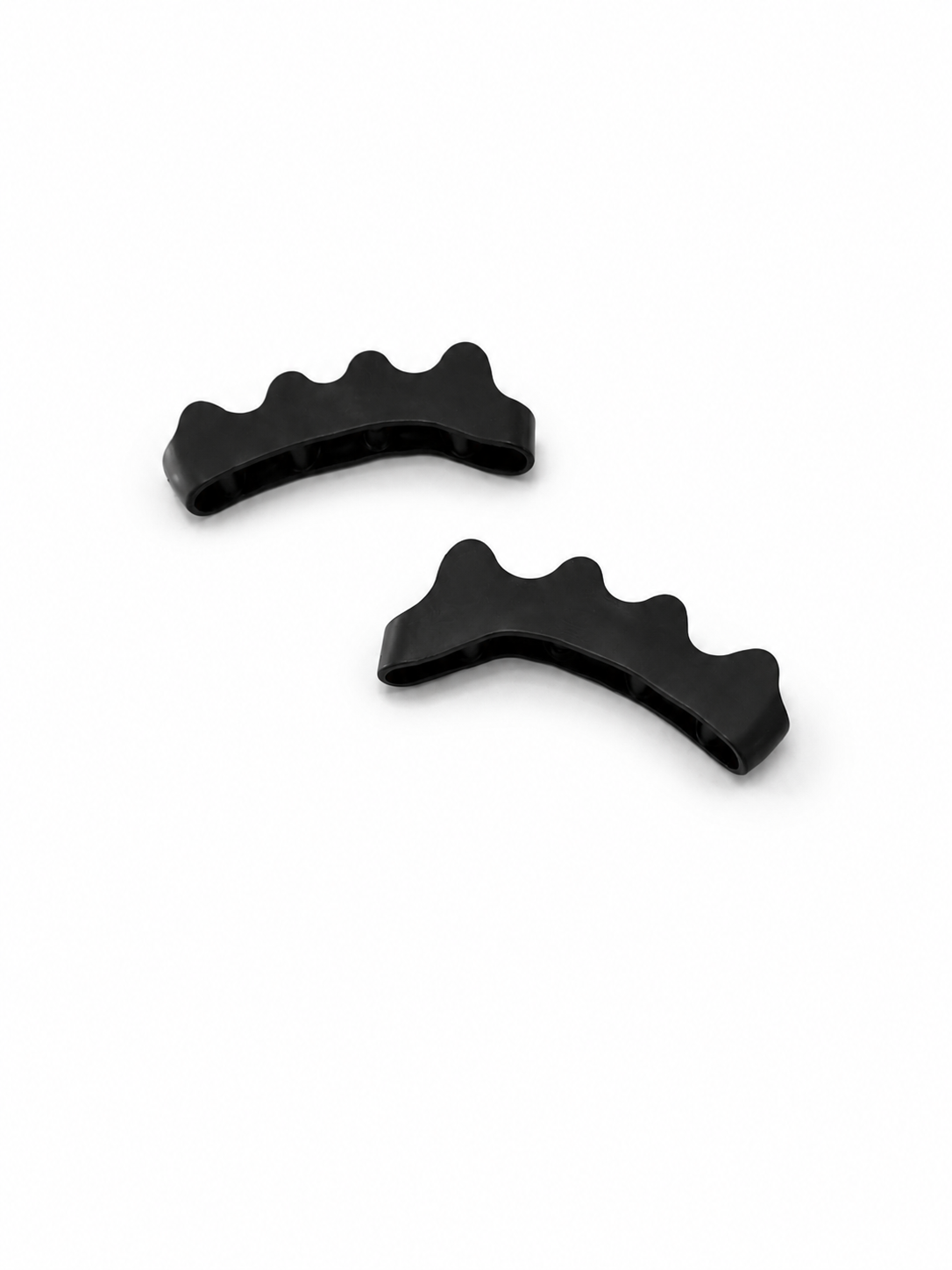 A PAIR OF BLACK TOE SPACERS
