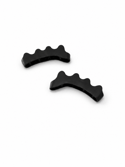 A PAIR OF BLACK TOE SPACERS
